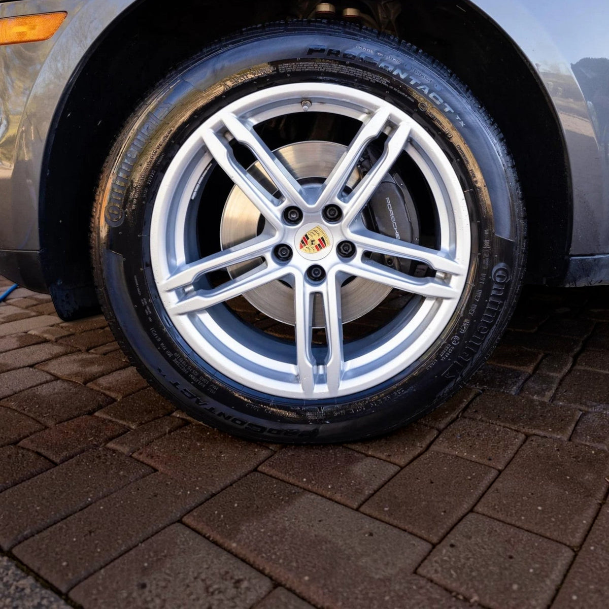 T-Top Vibes AllGuard Tire GSS graphene tire dressing applied to a car tire for a clean, satin-black finish.