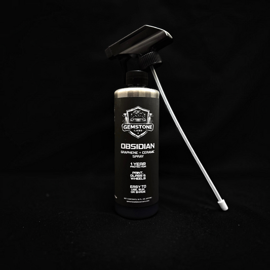 T-Top Vibes Obsidian Graphene + Ceramic Spray bottle for vehicle paint and wheel protection on a black background.