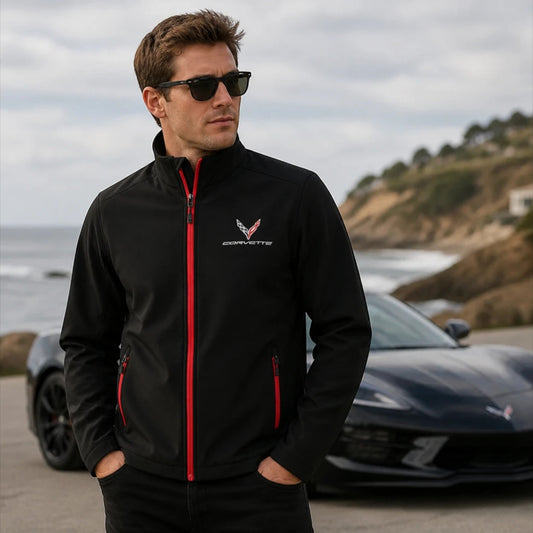 Corvette owner wearing an officially licensed Corvette jacket beside a sports car