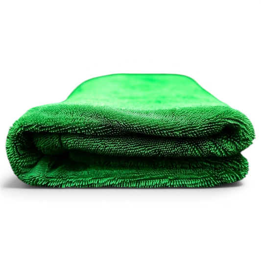 T-Top Vibes emerald green 1200 GSM twisted-loop microfiber drying towel resting on a wet carbon fiber car surface.