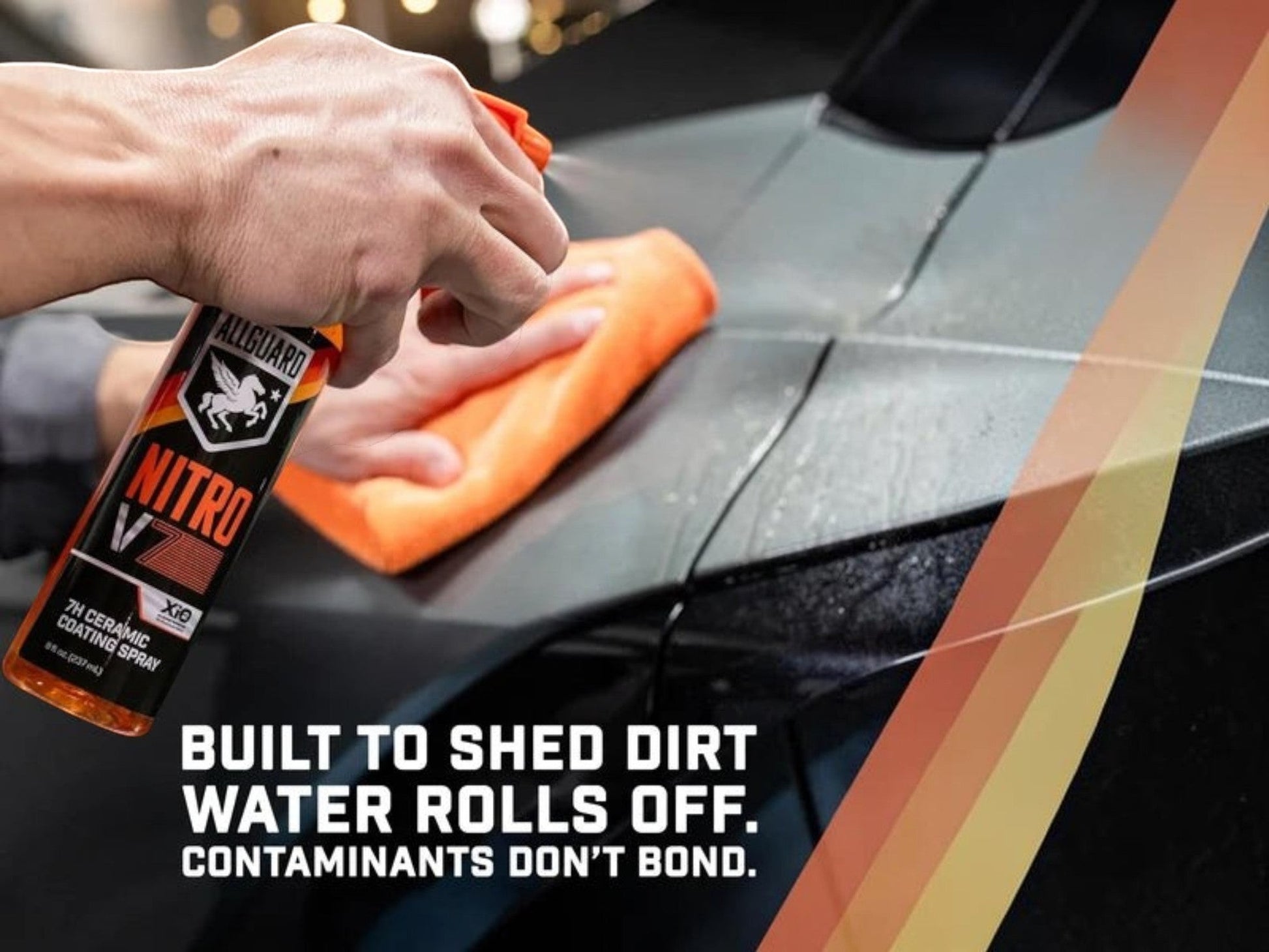 T-Top Vibes AllGuard NITRO V7 ceramic coating spray being applied to a car panel with an orange microfiber towel