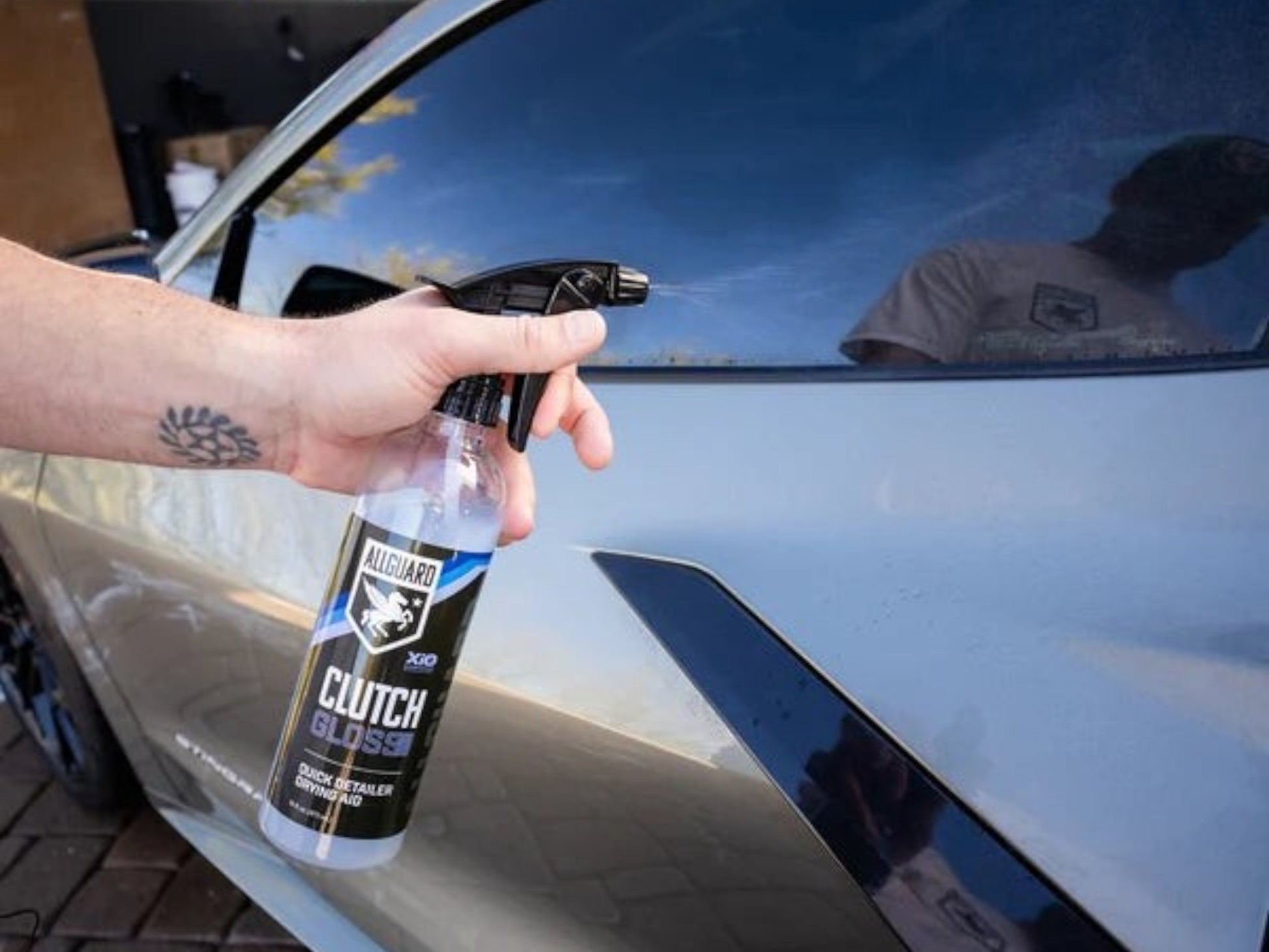 T-Top Vibes AllGuard Clutch GLOSS spray being applied to a car exterior for a high-gloss finish