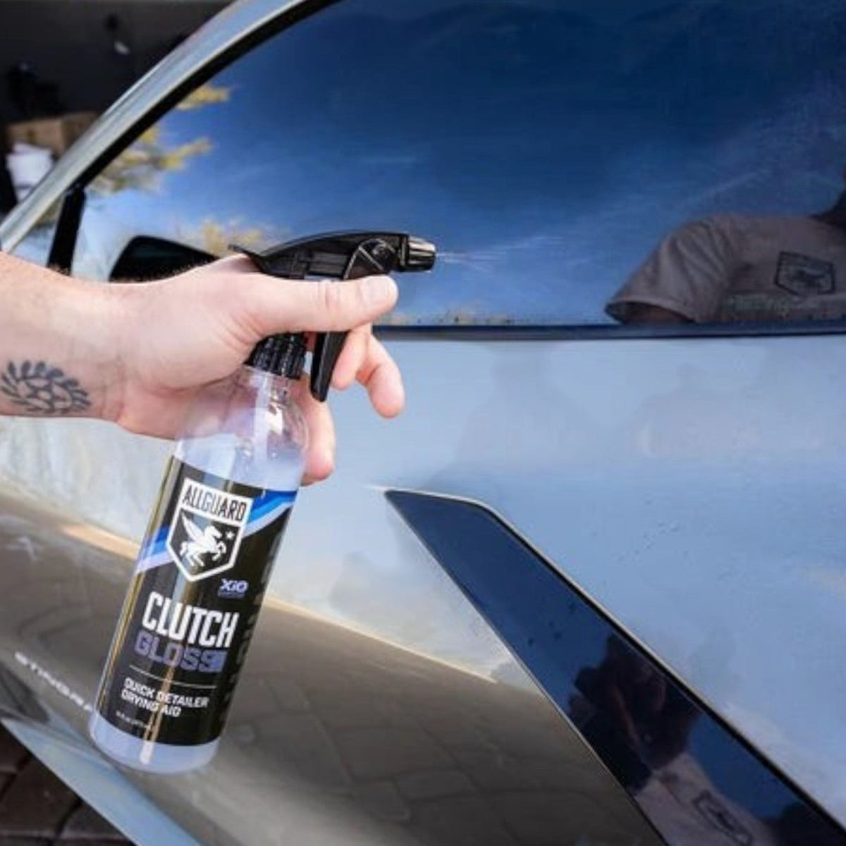 T-Top Vibes AllGuard Clutch GLOSS spray being applied to a car exterior for a high-gloss finish