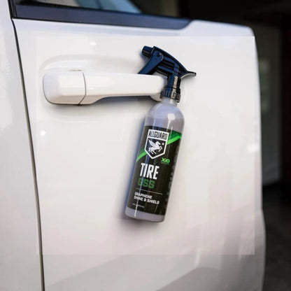 T-Top Vibes AllGuard Tire GSS graphene tire dressing spray bottle hanging on a white vehicle door handle