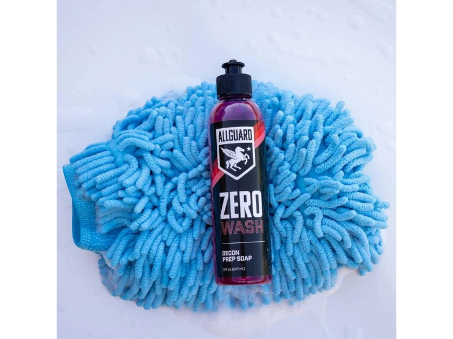 T-Top Vibes AllGuard ZERO decontamination wash soap bottle resting on a blue microfiber car wash mitt