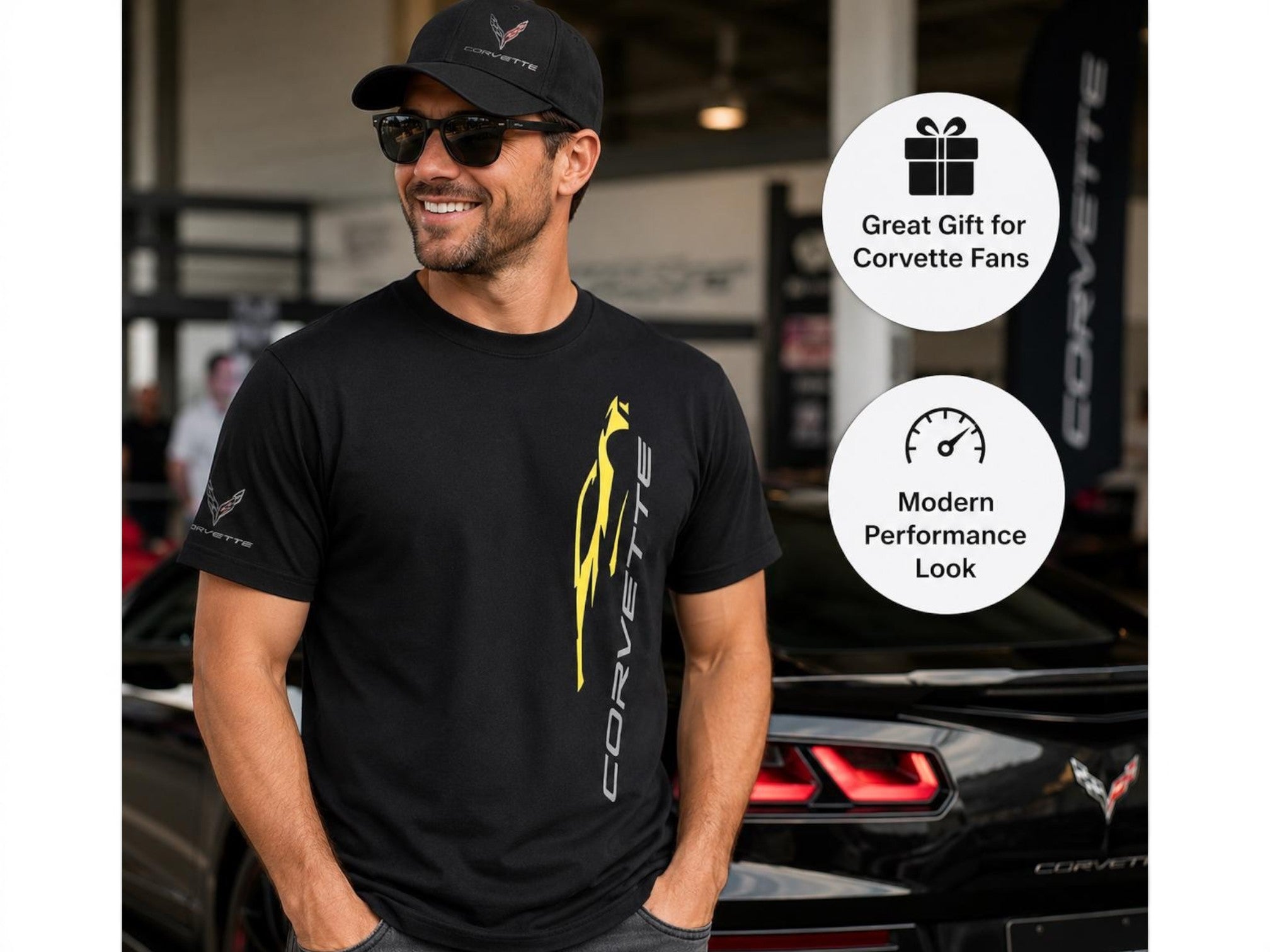 T-Top Vibes black cotton C8 Corvette t-shirt with yellow vertical graphic and sleeve logo worn by a man at a car show