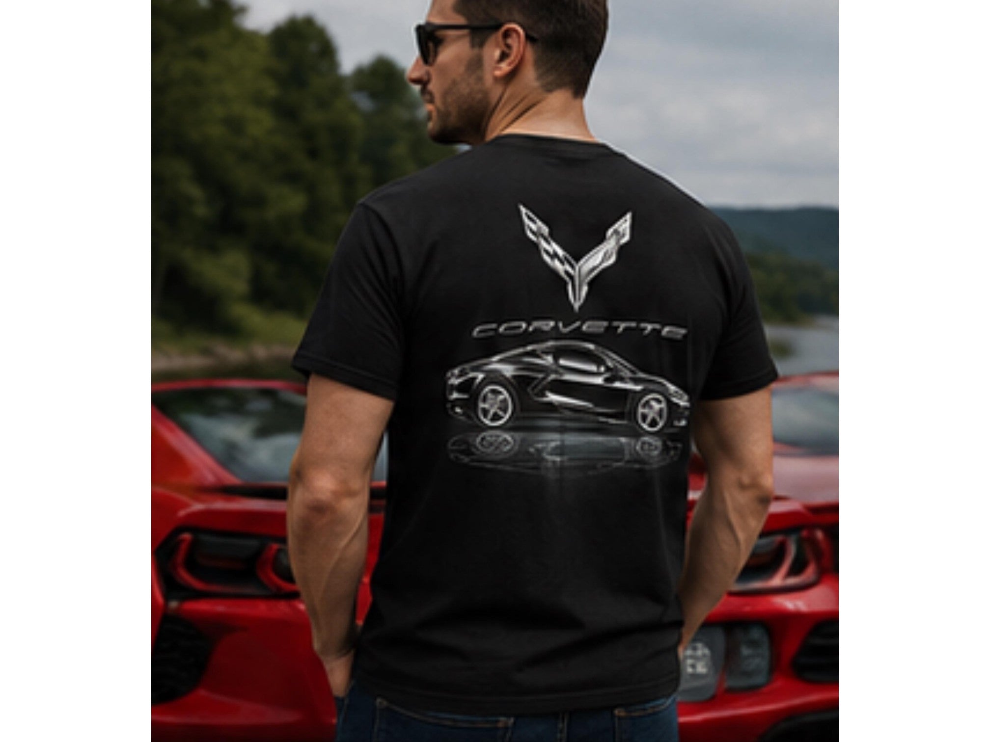 T-Top Vibes black cotton T-shirt featuring a metallic C8 Corvette graphic on the back, worn by a man outdoors.