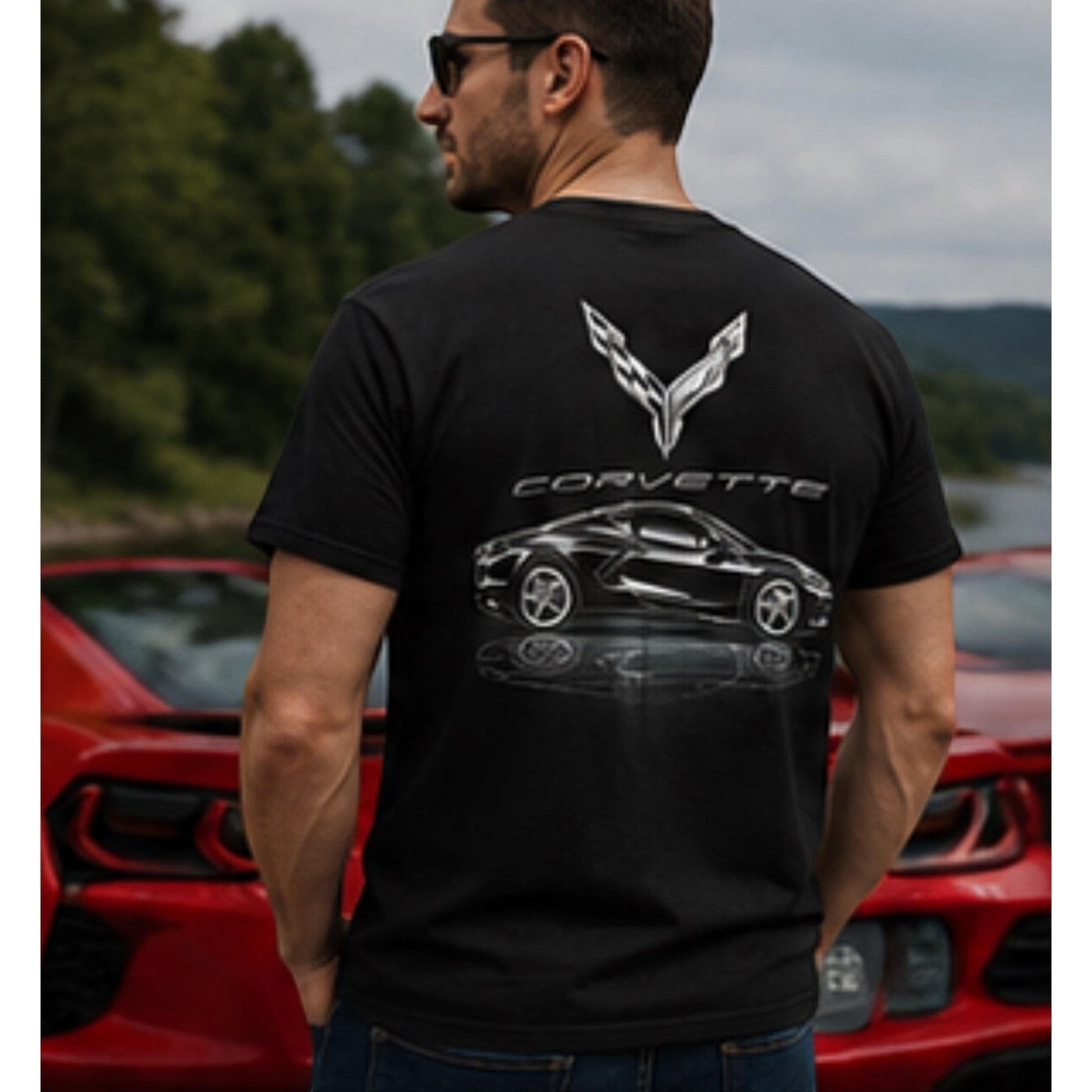 T-Top Vibes black cotton T-shirt featuring a metallic C8 Corvette graphic on the back, worn by a man outdoors.