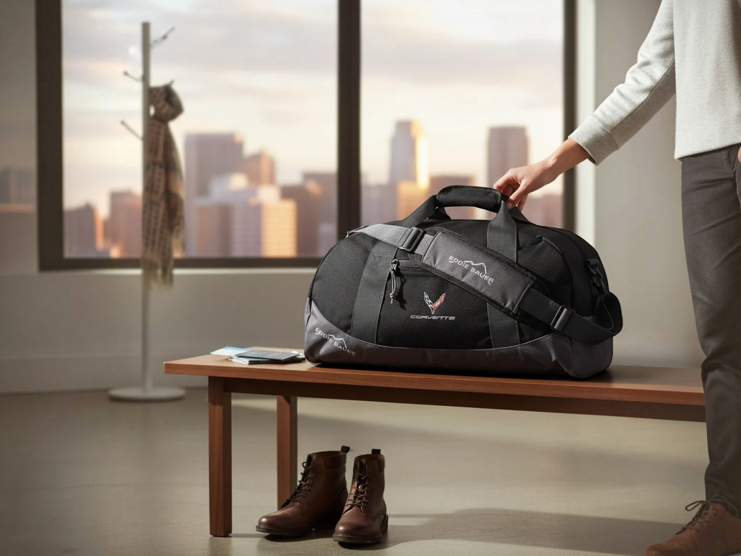 T-Top Vibes black Eddie Bauer Corvette duffel bag with embroidered emblem sitting on a wooden bench