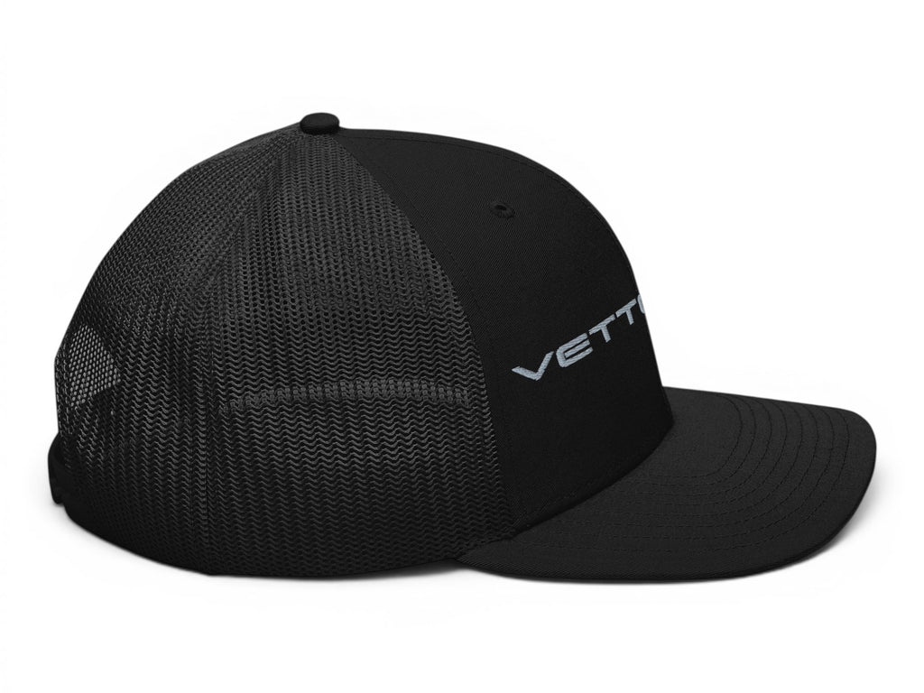 T-Top Vibes black trucker hat with Vette Life embroidery, structured front panels, and breathable mesh back.