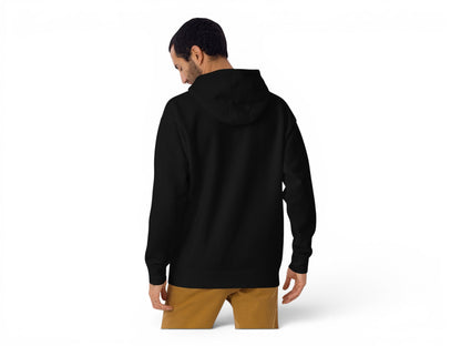 T-Top Vibes black unisex hoodie with a three-panel hood, viewed from the back on a model wearing tan trousers.