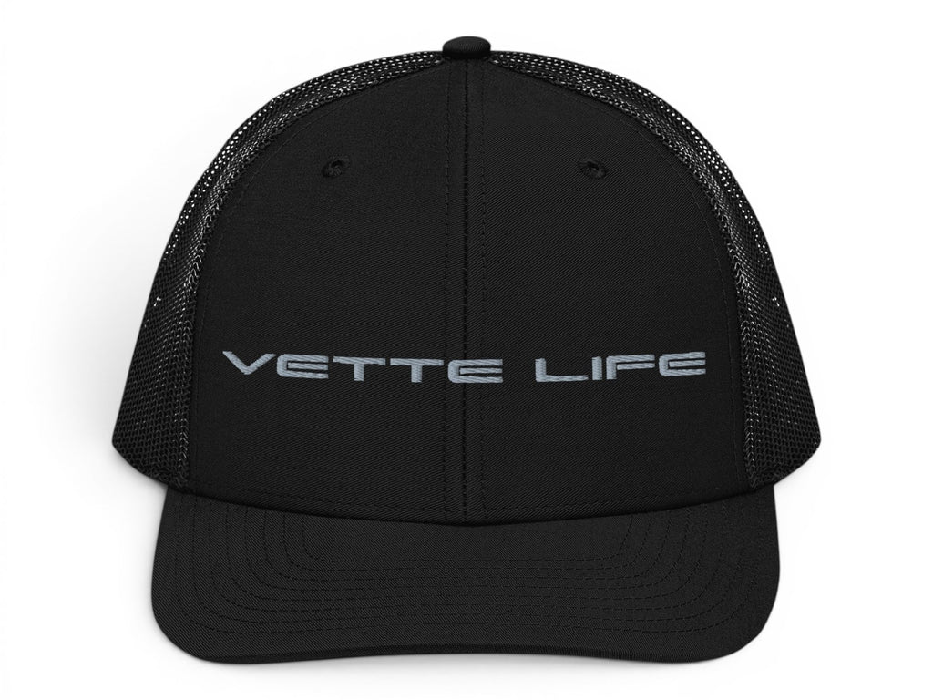 T-Top Vibes black trucker hat with Vette Life embroidered on the front, featuring a structured fit and mesh back.