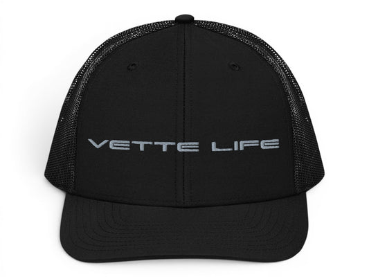 T-Top Vibes black trucker hat with Vette Life embroidered on the front, featuring a structured fit and mesh back.