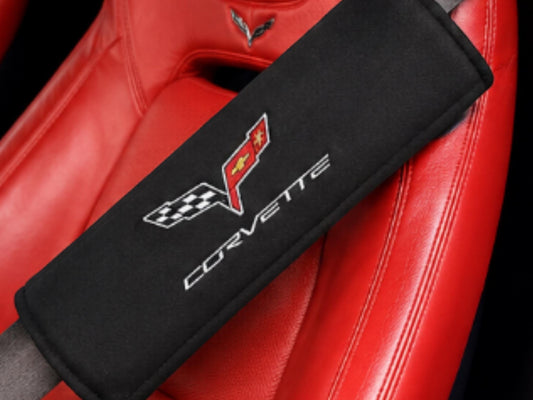 T-Top Vibes black C6 Corvette seat belt cover with embroidered crossed flags logo