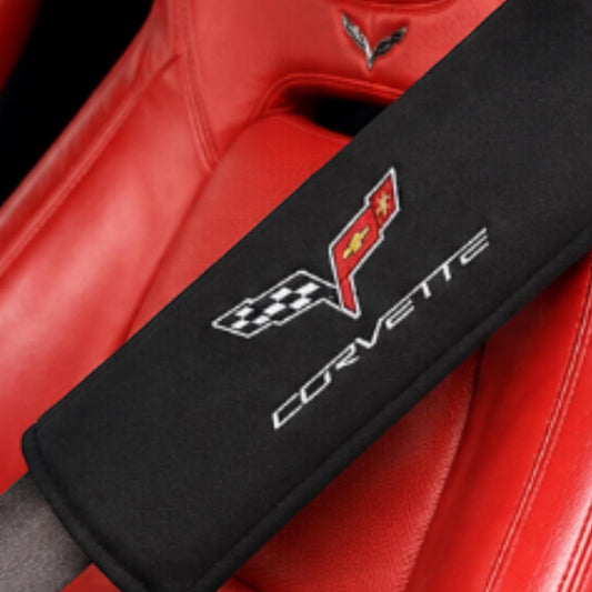 T-Top Vibes black C6 Corvette seat belt cover with embroidered crossed flags logo