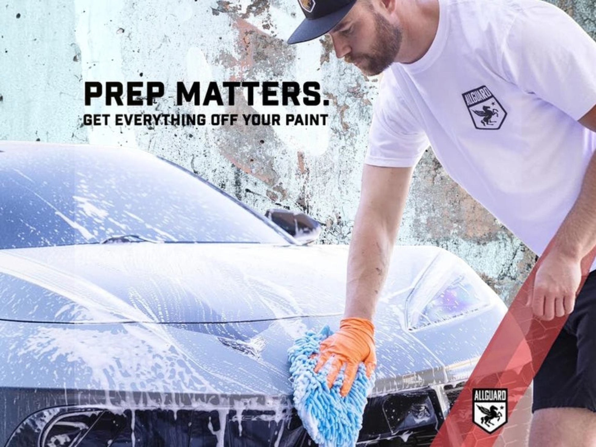 T-Top Vibes man washing a black car with AllGuard ZERO decontamination soap using a blue microfiber mitt