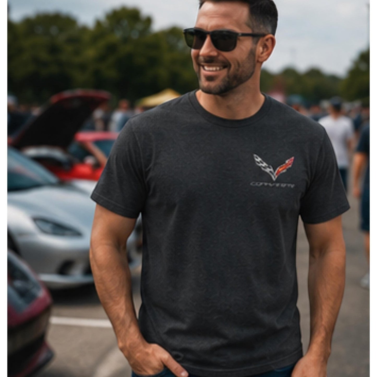 Man wearing a T-Top Vibes charcoal heather Corvette C7 t-shirt with a small crossed flags logo on the chest