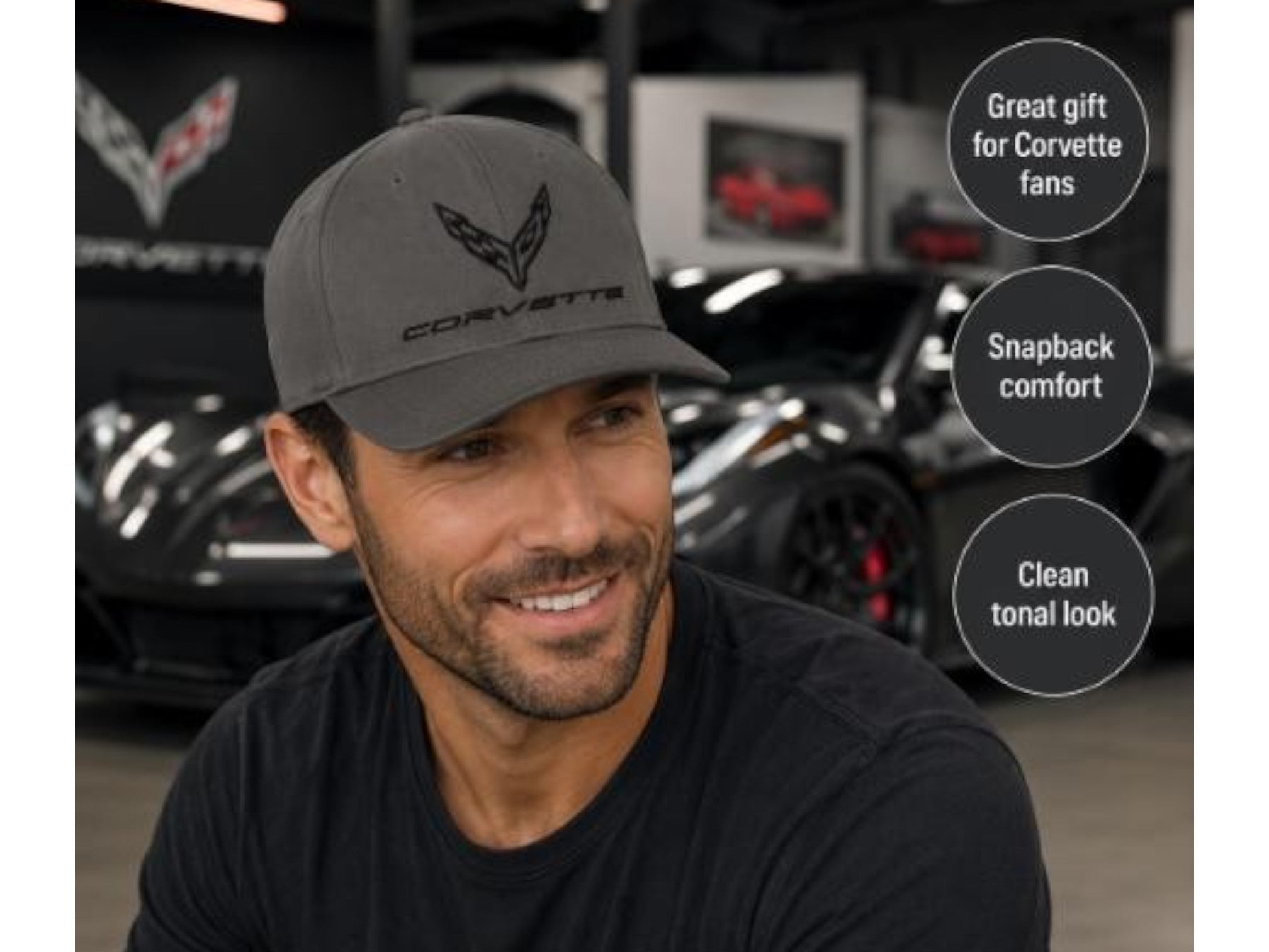 T-Top Vibes charcoal C8 Corvette snapback cap with tonal flag logo on a man in a garage setting.