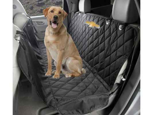 T-Top Vibes Chevrolet pet hammock in black quilted fabric with logo, protecting a car back seat with a dog sitting on it.
