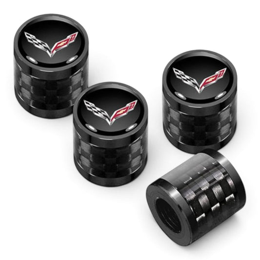 T-Top Vibes Corvette C7 carbon fiber valve stem caps with glossy black finish and crossed-flags emblem, set of four.