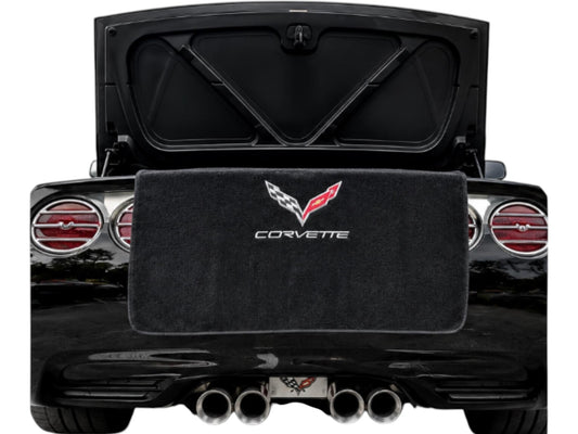 T-Top Vibes black cotton terry velour trunk towel with embroidered Corvette logo protecting a C7 Corvette rear bumper.