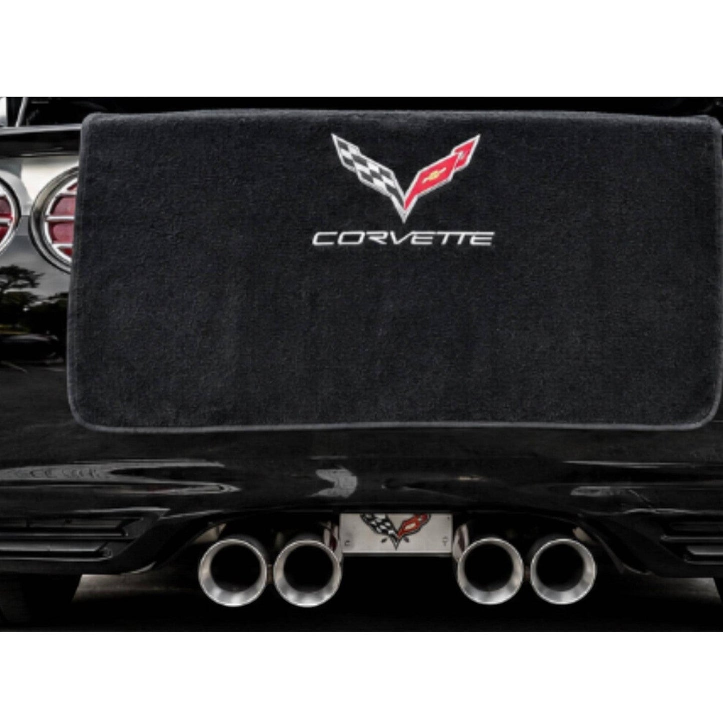 T-Top Vibes black cotton terry velour trunk towel with embroidered Corvette logo draped over a C7 Corvette bumper.