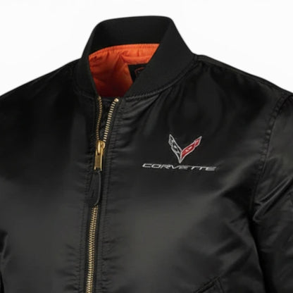 T-Top Vibes black Corvette C8 bomber flight jacket with gold zipper, orange lining, and embroidered chest emblem.
