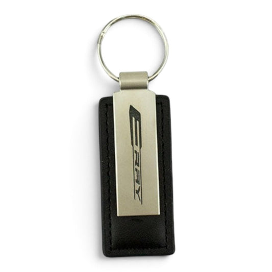 T-Top Vibes Corvette E-Ray key tag featuring a sleek black leather strap and brushed metal plate with logo