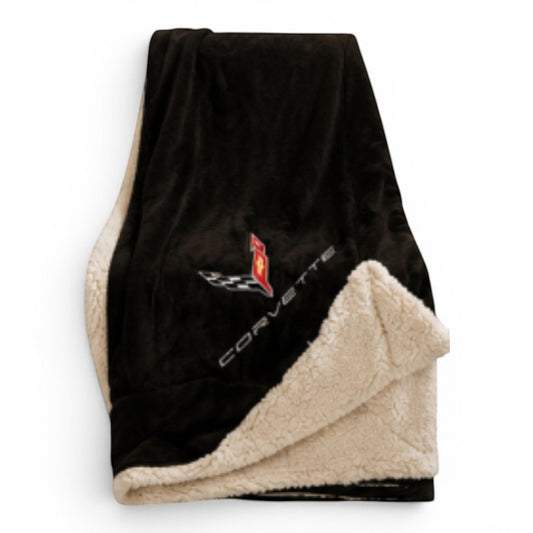 T-Top Vibes black plush Corvette throw blanket with embroidered logo and cream-colored faux sherpa fleece backing.