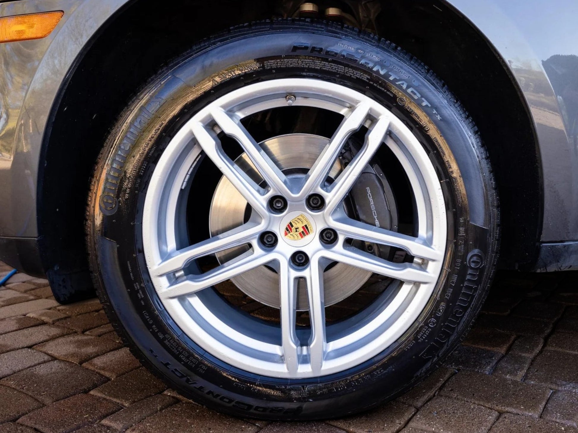 T-Top Vibes AllGuard Tire GSS graphene tire dressing applied to a car tire for a clean, satin-black finish.