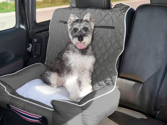 T-Top Vibes grey quilted pet bed and car seat cover with a Schnauzer sitting inside a vehicle