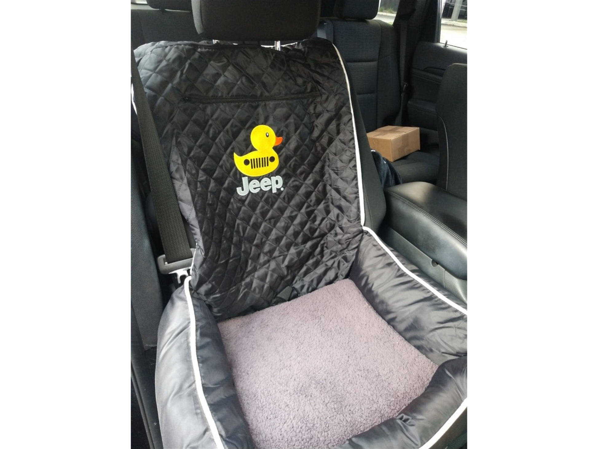 T-Top Vibes Jeep Duck pet bed and car seat cover in black quilted fabric with a yellow duck logo on a vehicle seat