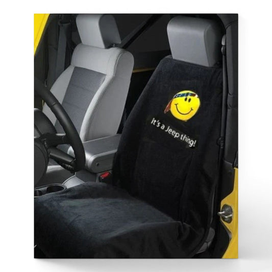 T-Top Vibes black cotton terry seat cover towel with a Jeep smiley face logo and text installed in a vehicle