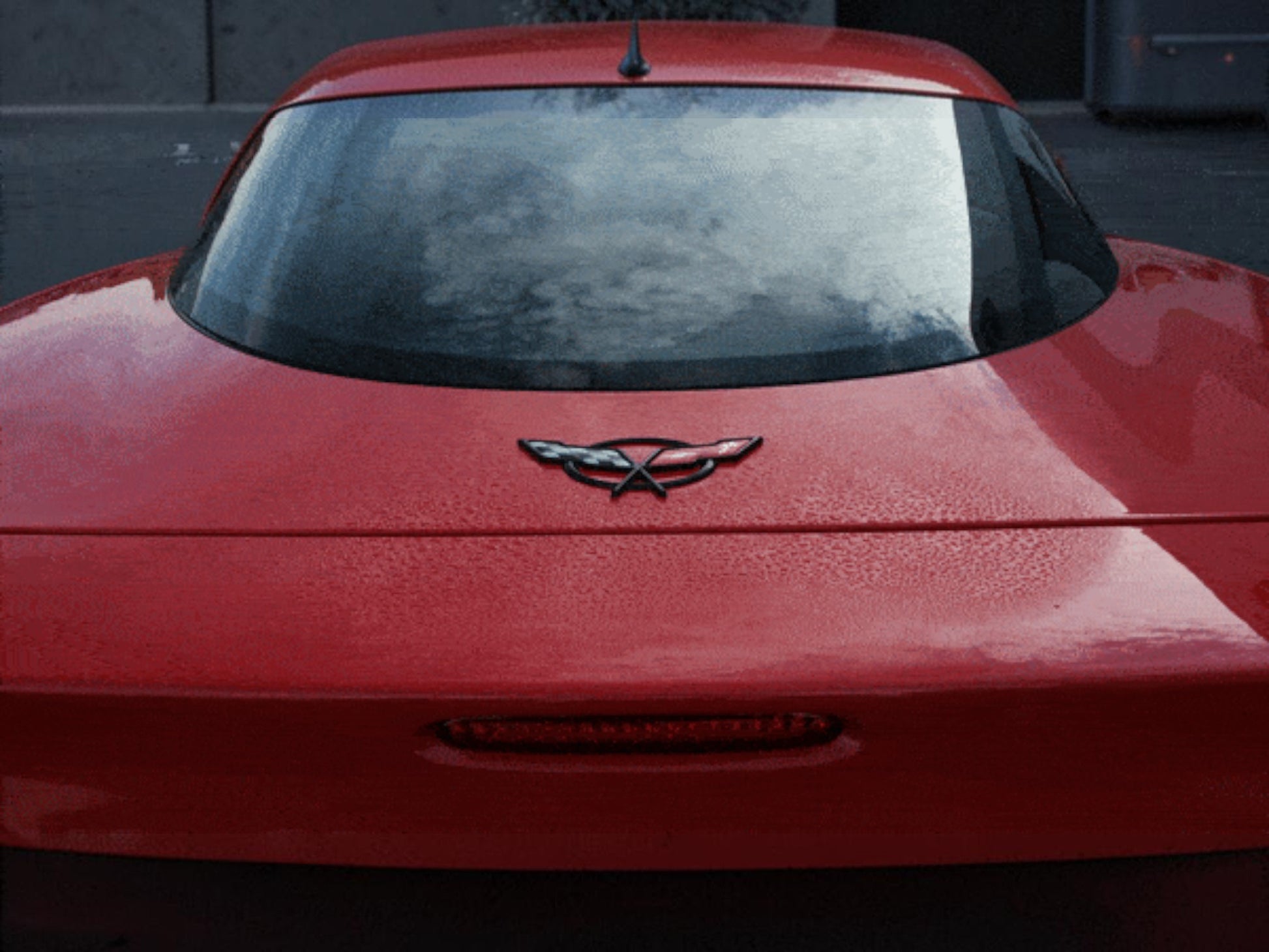 T-Top Vibes AllGuard Platinum gray microfiber drying towel being used to dry the red trunk of a sports car