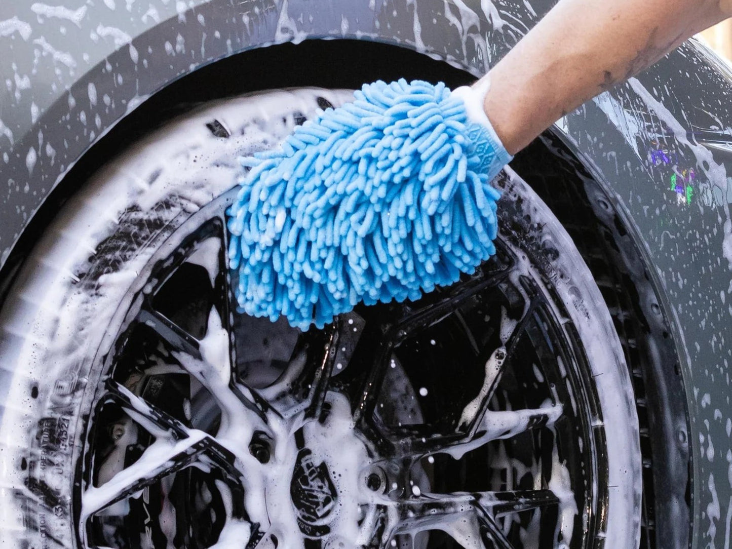 T-Top Vibes blue microfiber wash mitt cleaning a soapy car wheel with AllGuard detailing kit accessories