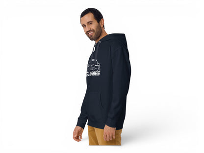 A man wearing a navy blue T-Top Vibes Pontiac Trans Am WS6 hoodie with a white graphic print and front pouch pocket.