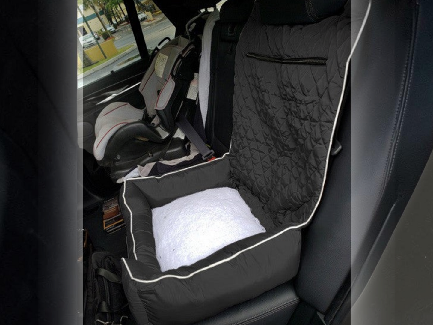 T-Top Vibes universal pet bed and car seat cover in black quilted cotton with a white plush cushion in a vehicle
