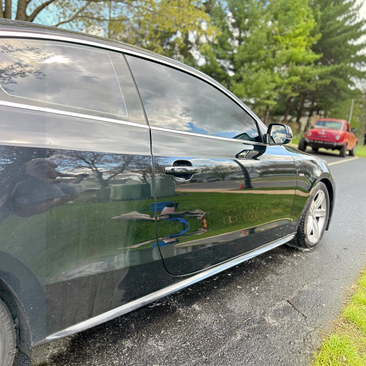T-Top Vibes Pink Sapphire car shampoo used on a clean, glossy black car exterior for a swirl-free finish