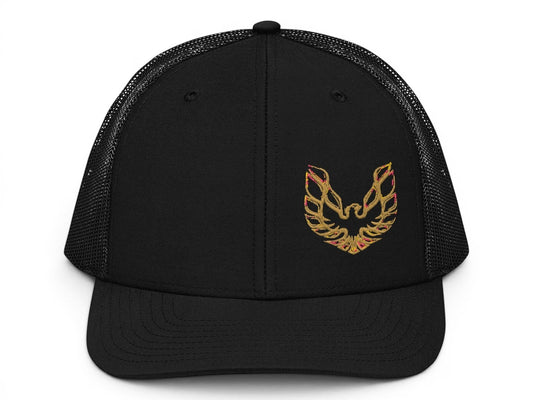 T-Top Vibes black trucker hat with an embroidered gold Pontiac Trans Am phoenix logo on the structured front panel.