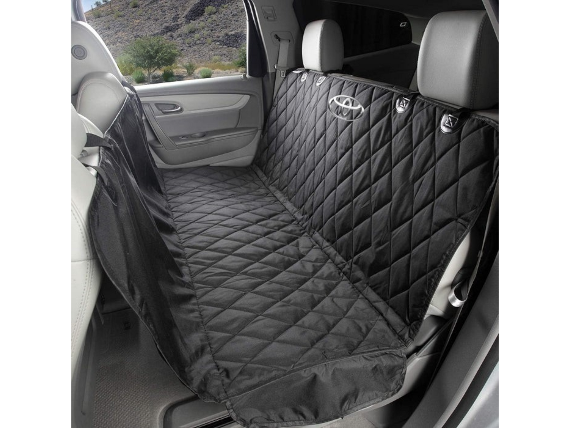 T-Top Vibes black quilted pet hammock with Toyota logo installed in a vehicle back seat for pet protection