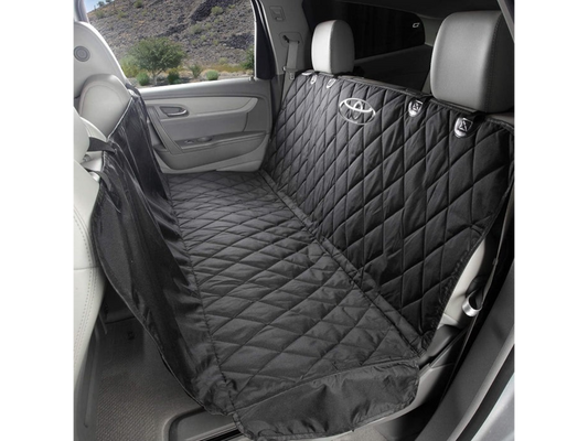 T-Top Vibes black quilted pet hammock with Toyota logo installed in a vehicle back seat for pet protection