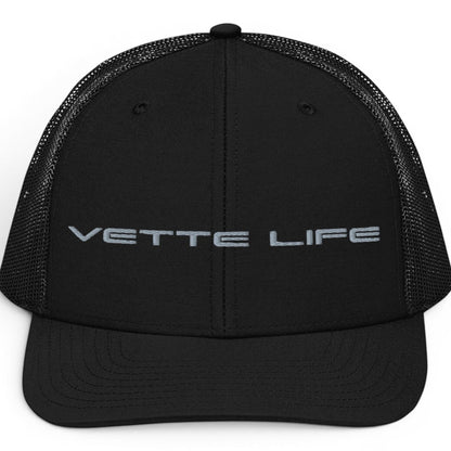 T-Top Vibes black trucker hat with Vette Life embroidered in grey on the structured front panel and mesh back