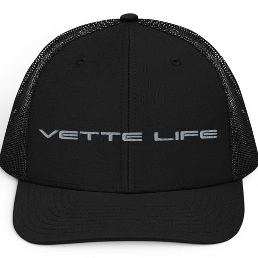 T-Top Vibes black trucker hat with Vette Life embroidered in grey on the structured front panel and mesh back